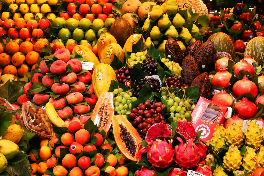 a large display of various fruits and vegetables