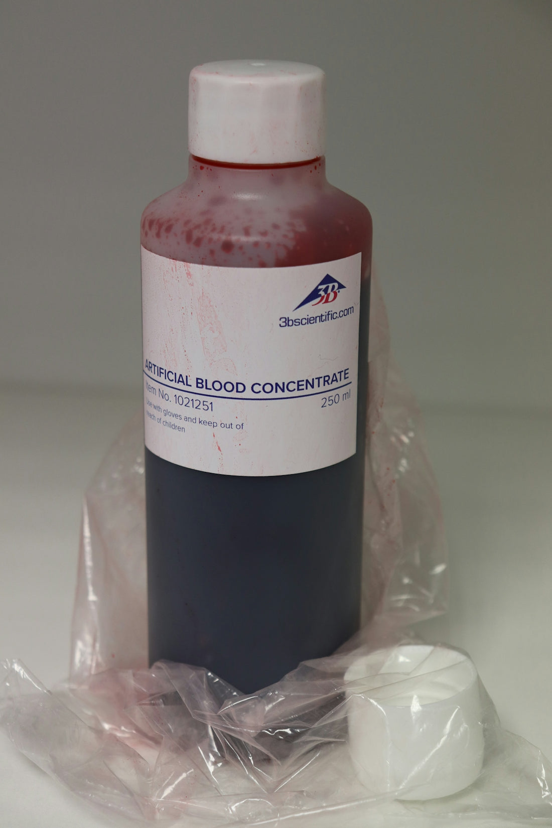 A bottle of blood sits on a plastic bag
